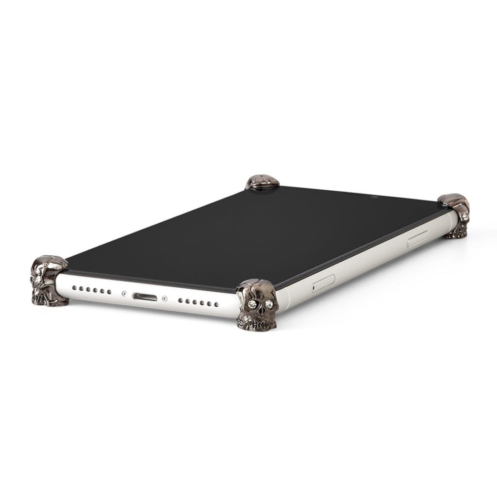 Carbon Skull ICONS installed on all four corners of a bare iPhone 11 Pro / Pro Max