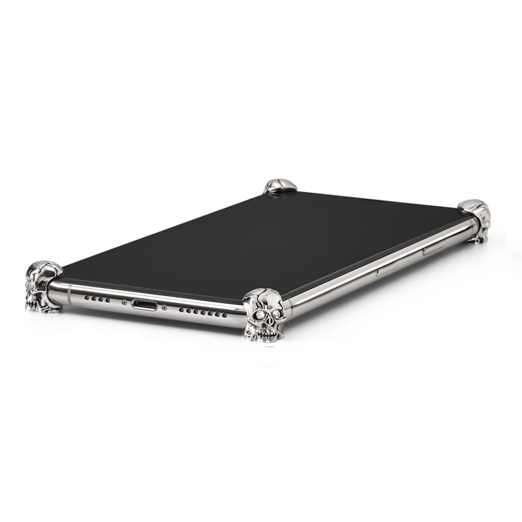 Silver Skull ICONS installed on all four corners of a bare iPhone 11 Pro / Pro Max