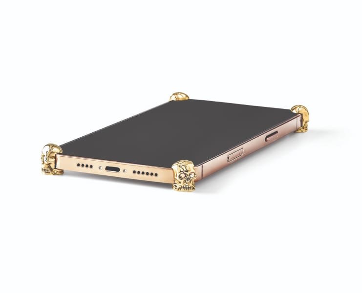 Gold Skull ICONS installed on all four corners of a bare iPhone 12 / 12 Pro / Max / mini