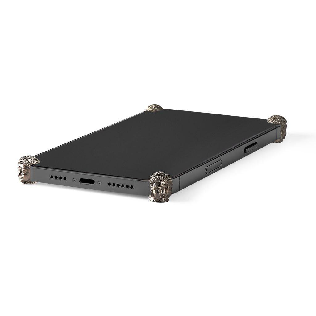 Carbon Buddha ICONS installed on all four corners of a bare iPhone 13 / 13 Pro / 13 Pro Max