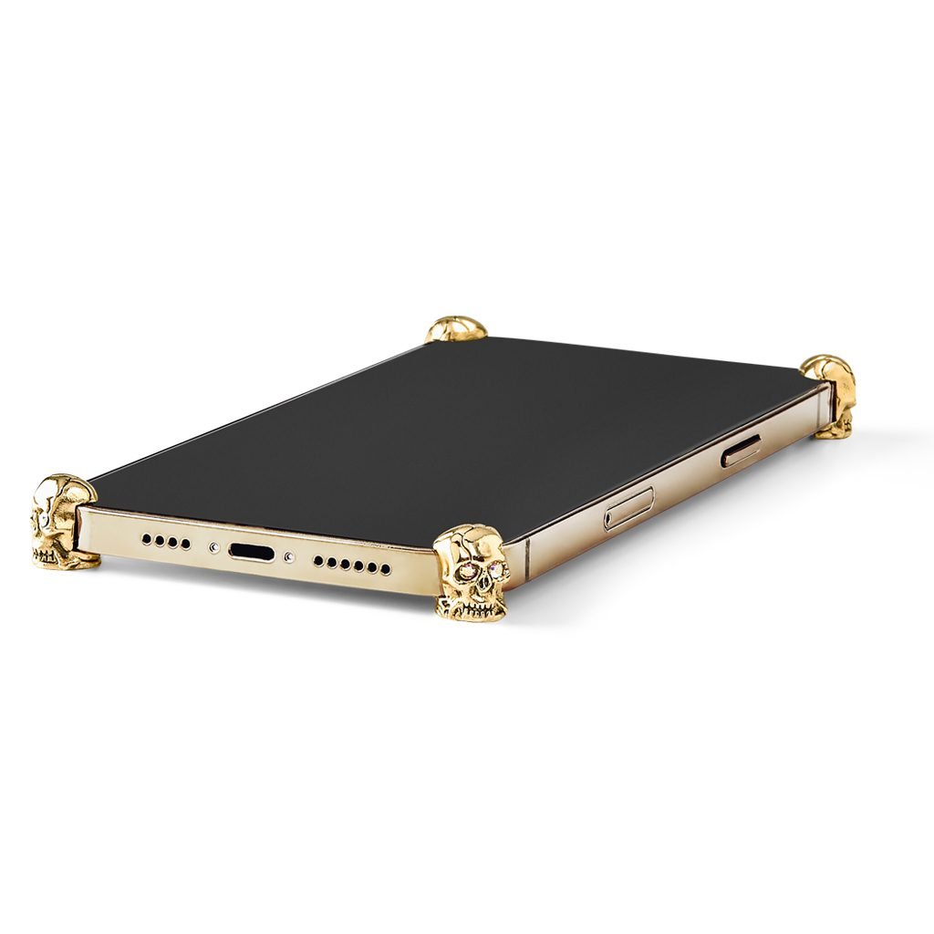 Gold Skull ICONS installed on all four corners of a bare iPhone 13 / 13 Pro / 13 Pro Max