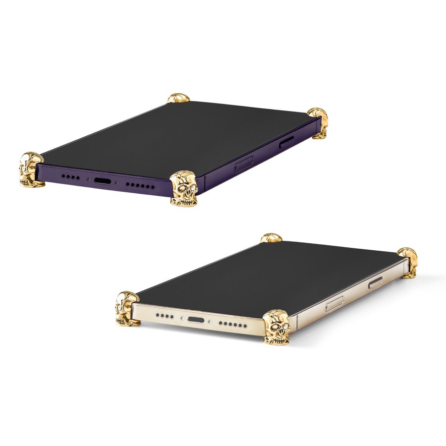 Gold Skull ICONS installed on all four corners of a bare iPhone 14 Pro / Pro Max