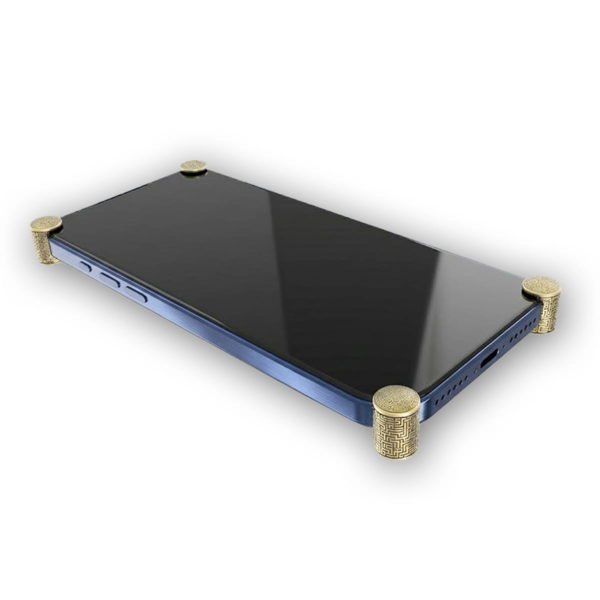 Gold Matrix ICONS installed on all four corners of a bare iPhone 17 Pro / Max