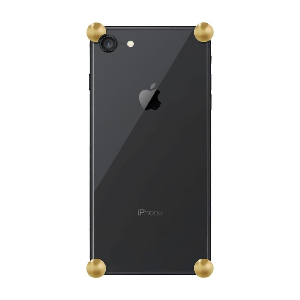 Gold Original CORNERS installed on all four corners of a bare iPhone SE (2nd gen)