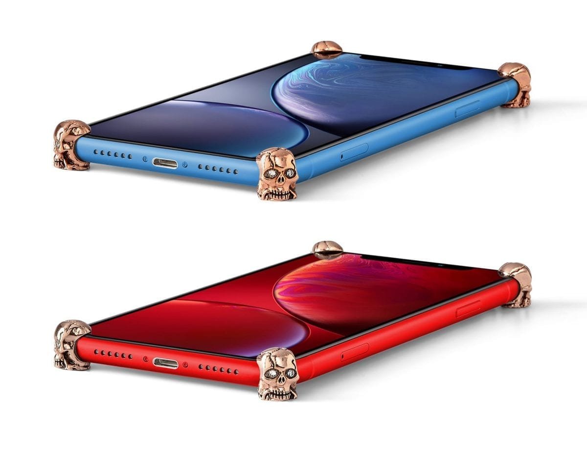 Rose Gold Skull ICONS installed on all four corners of a bare iPhone XR